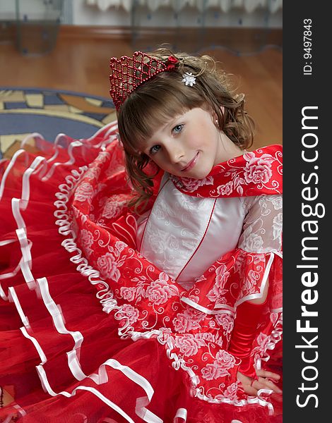 The teen poses in red dress, indoor. The teen poses in red dress, indoor