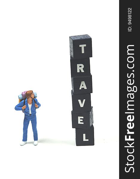 A backpacker next to the word travel