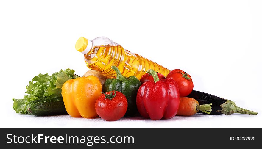 Still-life with fresh vegetables on a white background.
