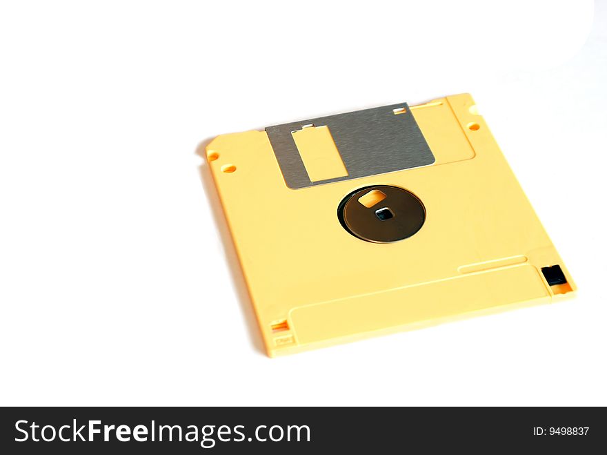 Yellow Floppy Disk isolated over a white background