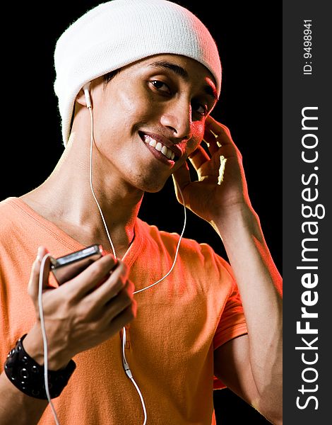 Asian male listening to music