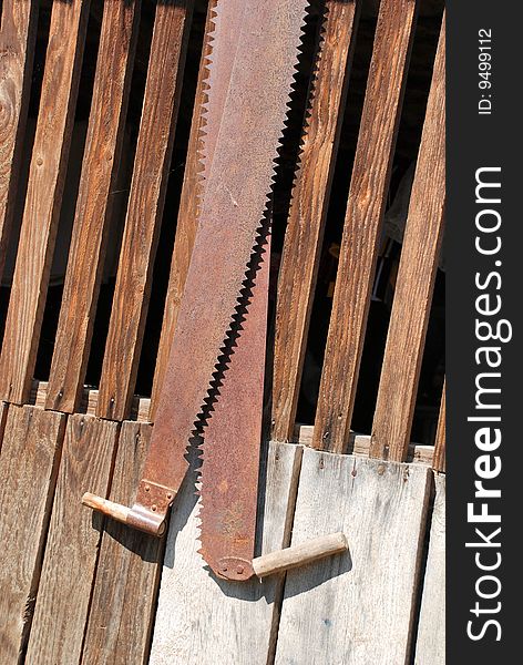 Two old bow saws hanging in a carpentry