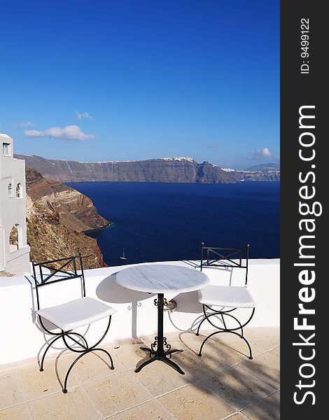 Two white chair on the balcony of seaside building. Two white chair on the balcony of seaside building