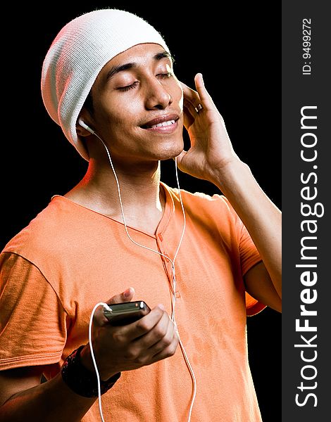 Asian male listening to music