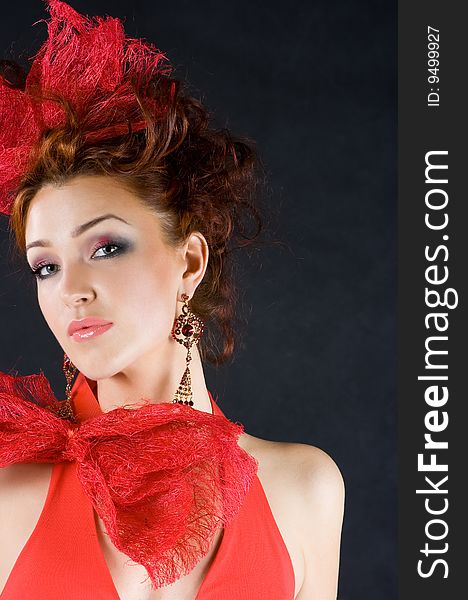 Beautiful red-haired girl in old fashion style studio shot