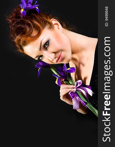 Red haired with flowers on black background