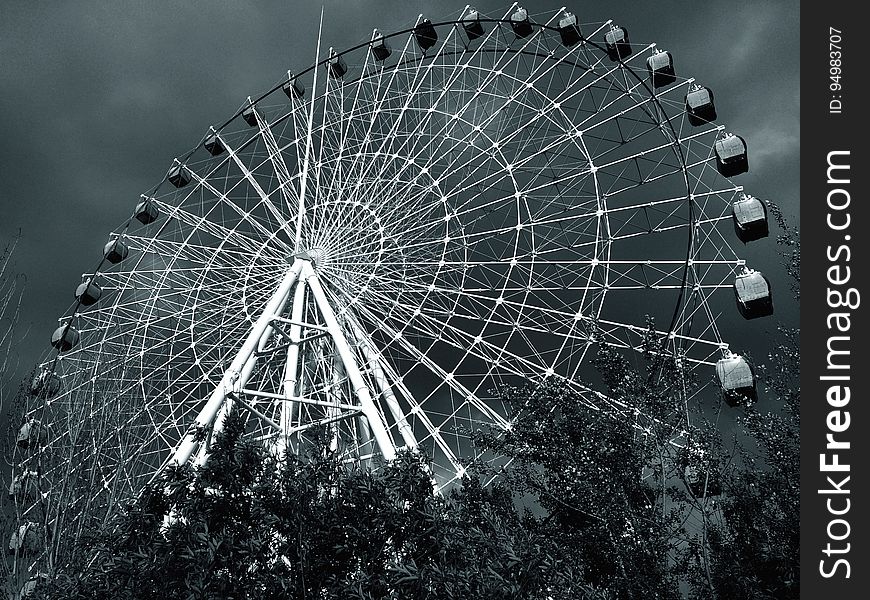 Ferris wheel in amusement park in black and white. Ferris wheel in amusement park in black and white.