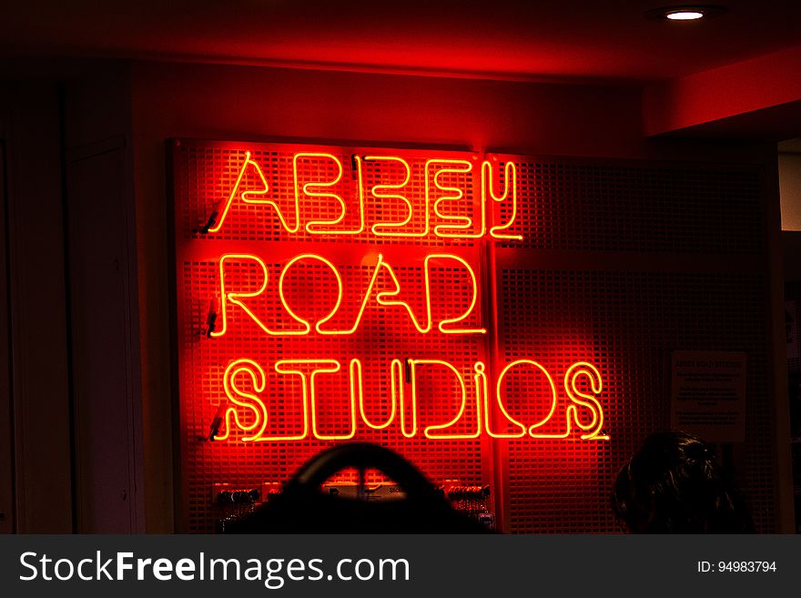 A neon sign with the text "Abbey Road Studios".