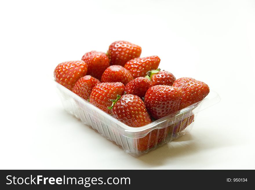 Close up shot of a bucket of strawberries