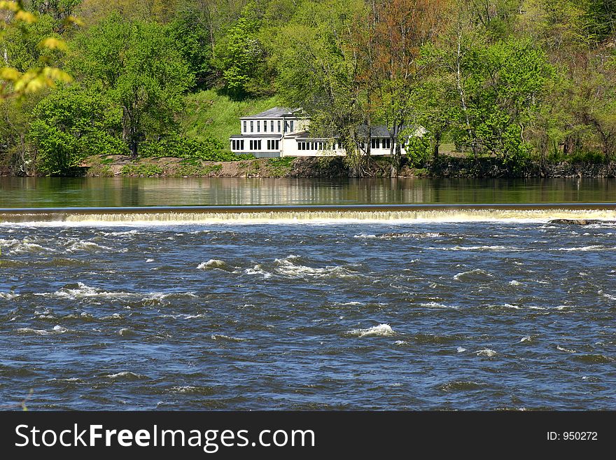 House overlooking the falls on the river. House overlooking the falls on the river.