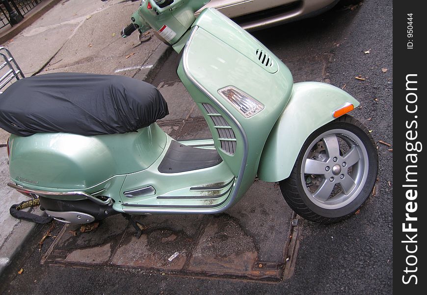 Green moped vespa