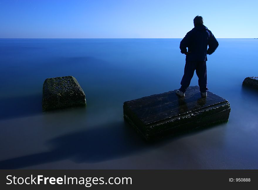 Man on sea in night