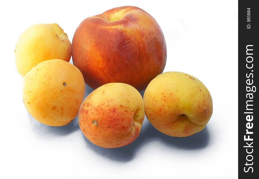 Peach and apricots on white background