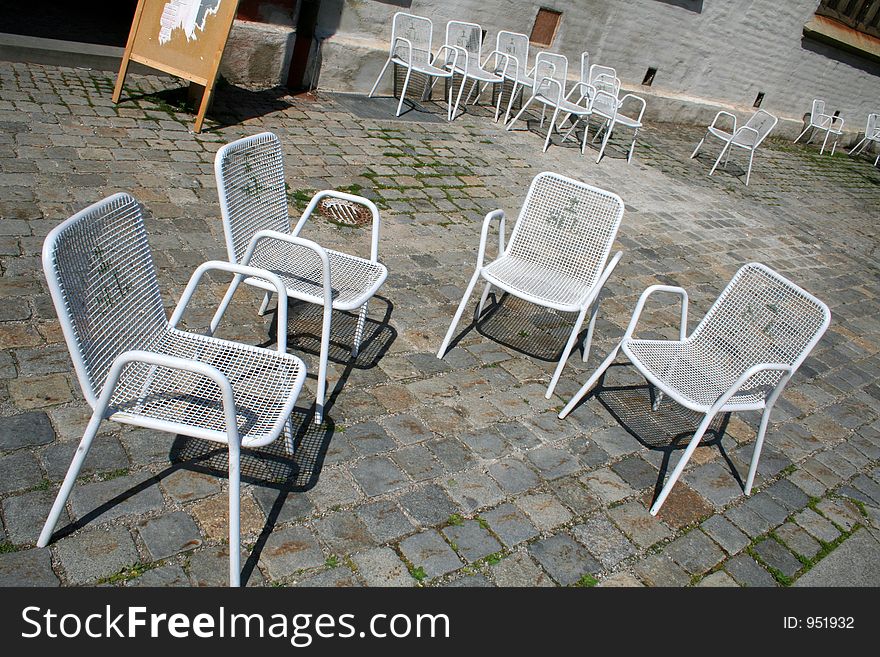 Four white chairs. Four white chairs