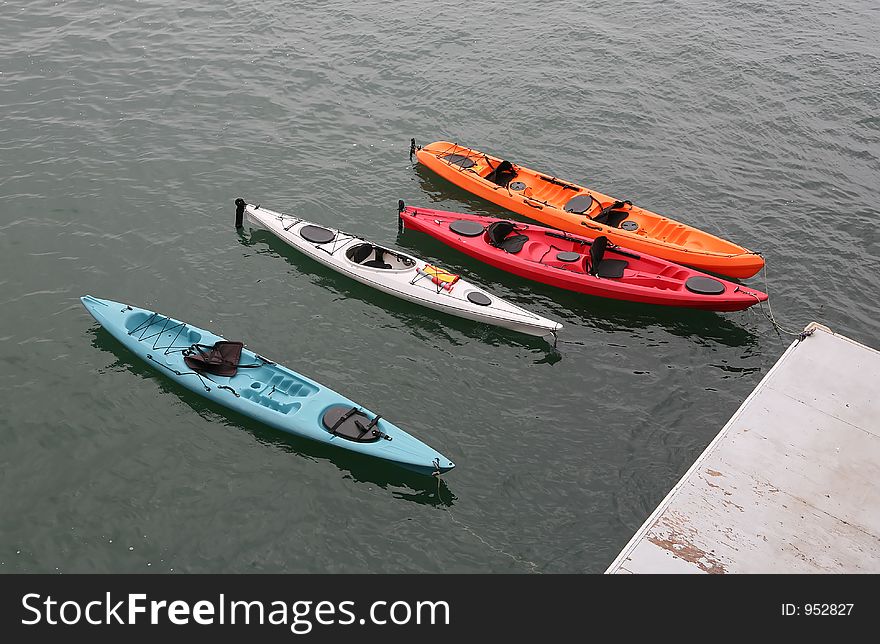 Colorful kayaks floating in the ocean