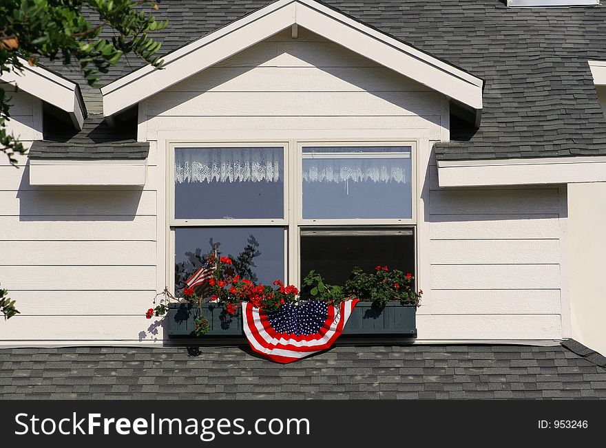 A house window box on Coronado Island decorated for the 4th of July holiday. A house window box on Coronado Island decorated for the 4th of July holiday.