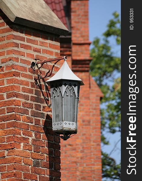 Old paraffin lamp mounted at Gietrzwald sanctuary's wall. Old paraffin lamp mounted at Gietrzwald sanctuary's wall