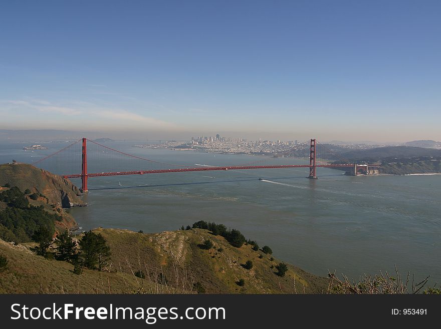 Panoramic view of the Golden Gate Bridge with Bay Bridge in the background. Panoramic view of the Golden Gate Bridge with Bay Bridge in the background.
