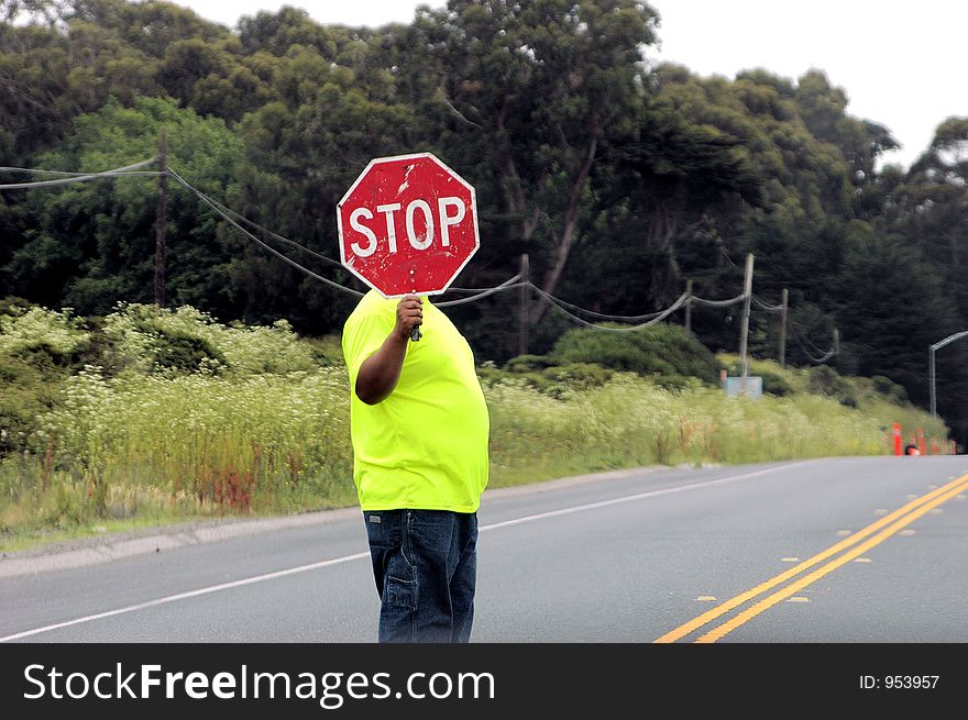 Road worker with a stop sign. Road worker with a stop sign