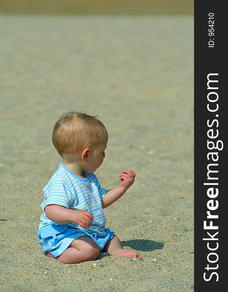 Small child exploring a beach in Cornwall. Small child exploring a beach in Cornwall.