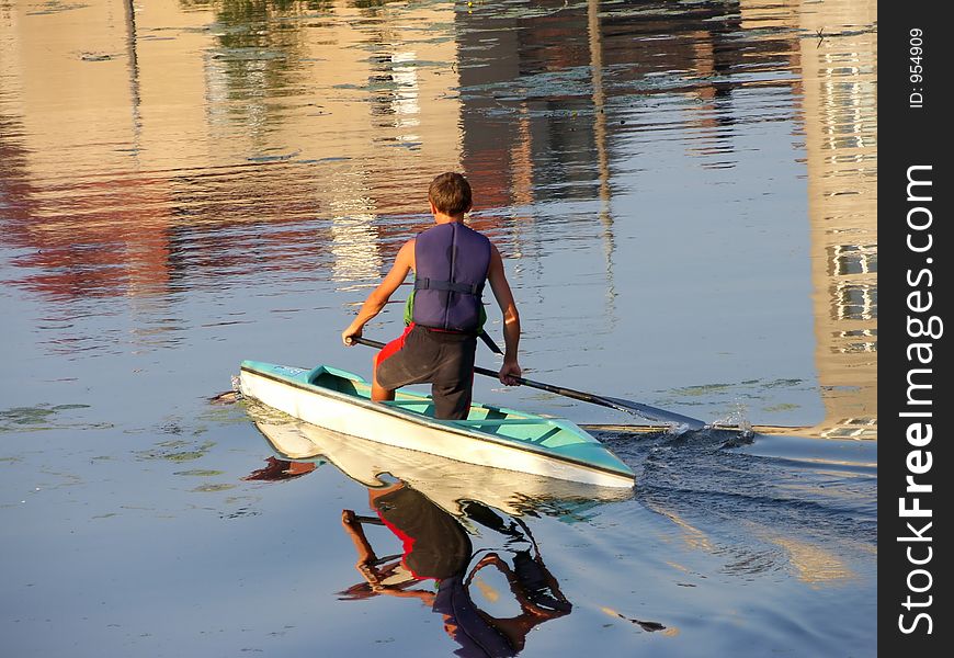 Young boy in blue kayak. Young boy in blue kayak