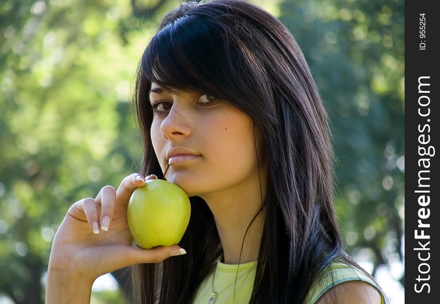 Beautiful girl with apple