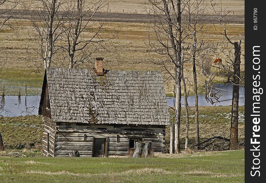 This image of the original house on the edge of the stream was taken in NW Montana. This image of the original house on the edge of the stream was taken in NW Montana.