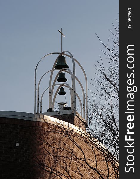 Modern church bells, cross and sky