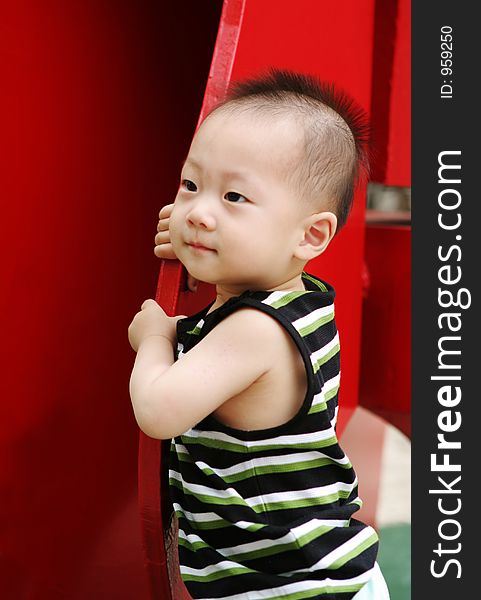 Cute Asian baby with a mohawk hairstyle. Cute Asian baby with a mohawk hairstyle