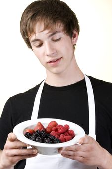 Young Man Looking Down At A Serving Of Berries Stock Photos Young Man Looking Down At A Serving Of Berries Stock Photos
