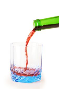 Red Wine Pouring Into Glass Stock Image