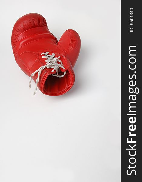 Red boxing glove with white lacing