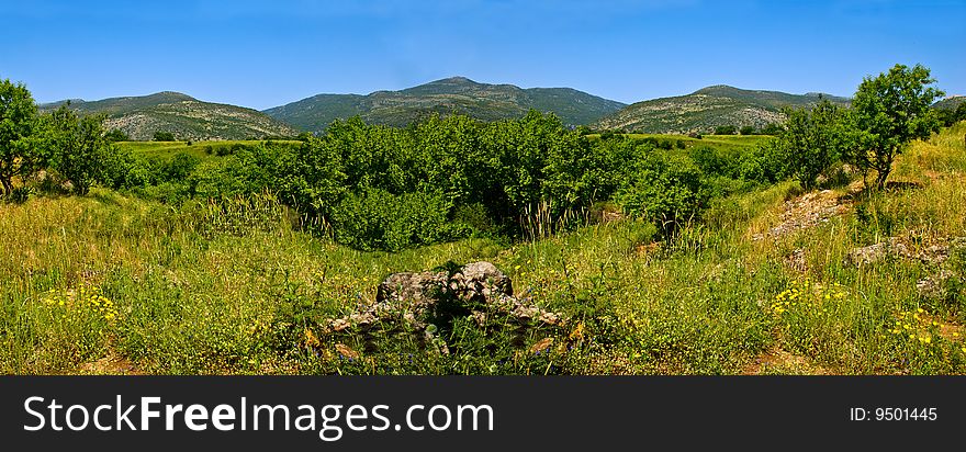 A mountains landscape in sunny day. Panorama photo.