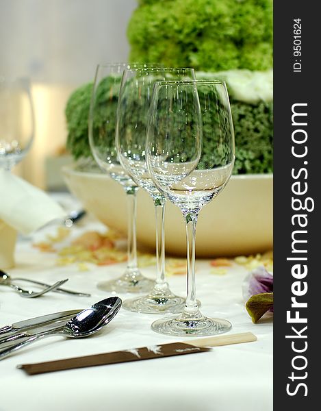 Wine glasses on a layed dining table