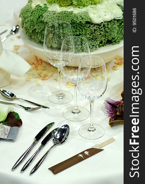 A luxury dining table with wine glasses, spoon and knifes. A luxury dining table with wine glasses, spoon and knifes