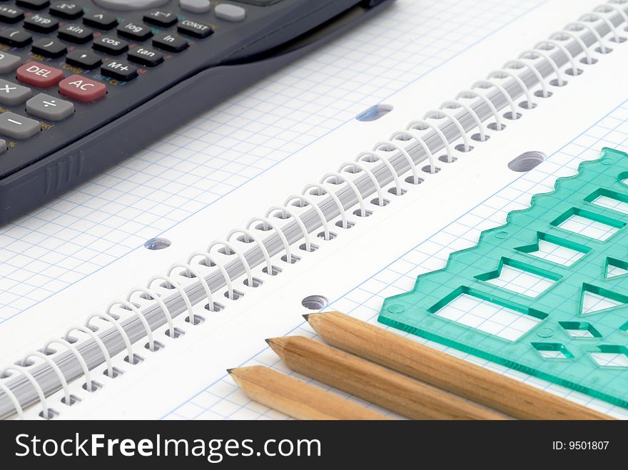 Spiral notebook with blue grid. Selective focus