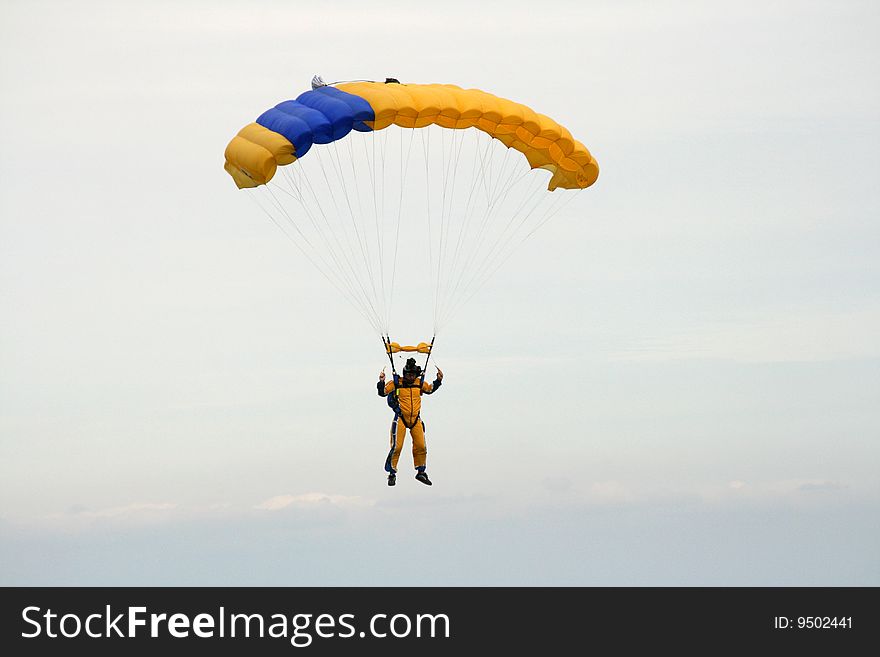 Skydiver coming into land with his parachute