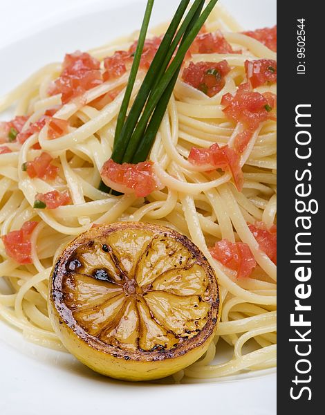 Plate Of Linguine Topped With Diced Tomatos