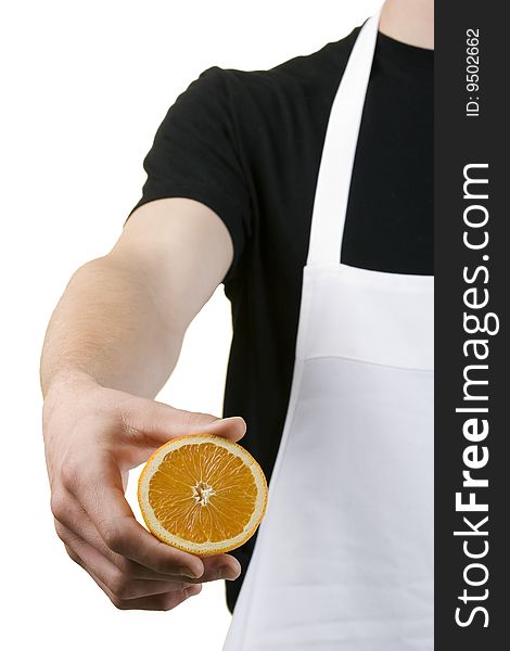 Body Of Cook Holding A Freshly Cut Orange