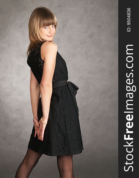 Girl In A Dress On A Grey Background