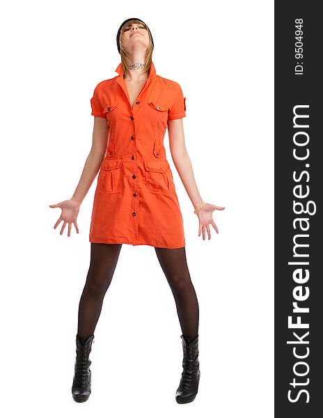 Glamor girl in a orange dress isolated on white posing in a studio