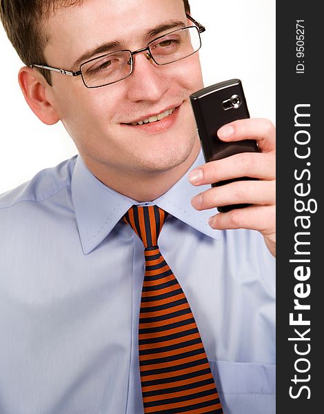 Handsome businessman looking at cellphone