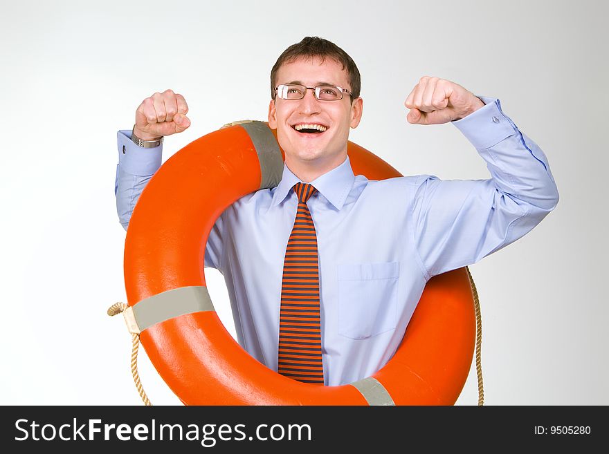 Young handsome businessman holding a life buoy