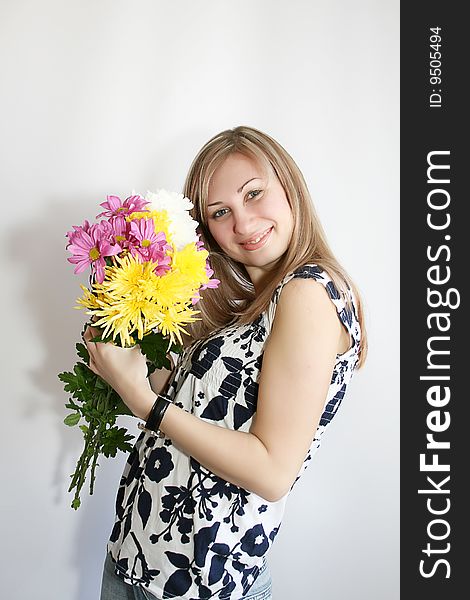 Happy young smiling woman with bunch of flowers. Happy young smiling woman with bunch of flowers