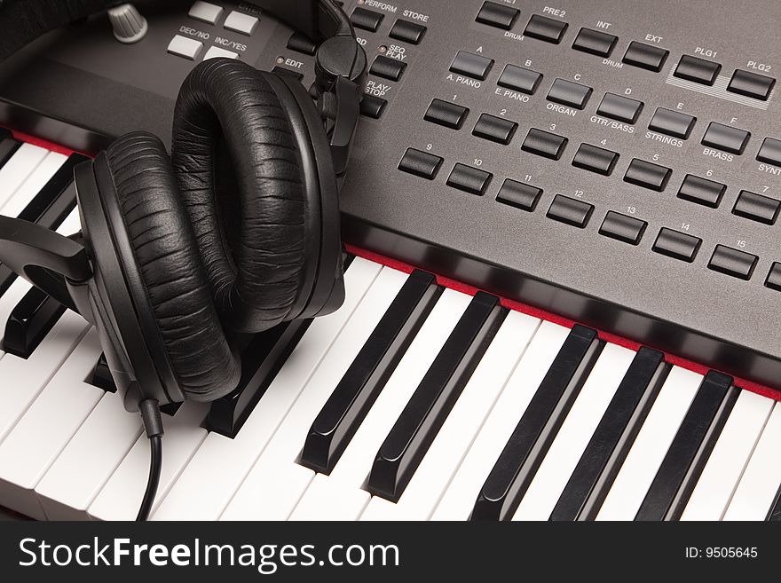 Headphones Laying on Electronic Keyboard with Narrow Depth of Fiel