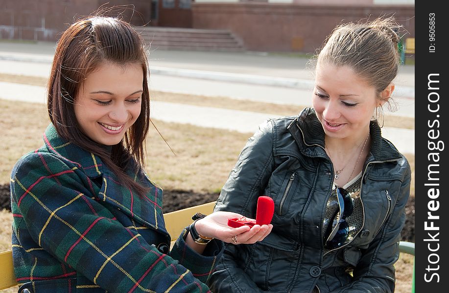 Girl Shows To Other Ring In Red Box