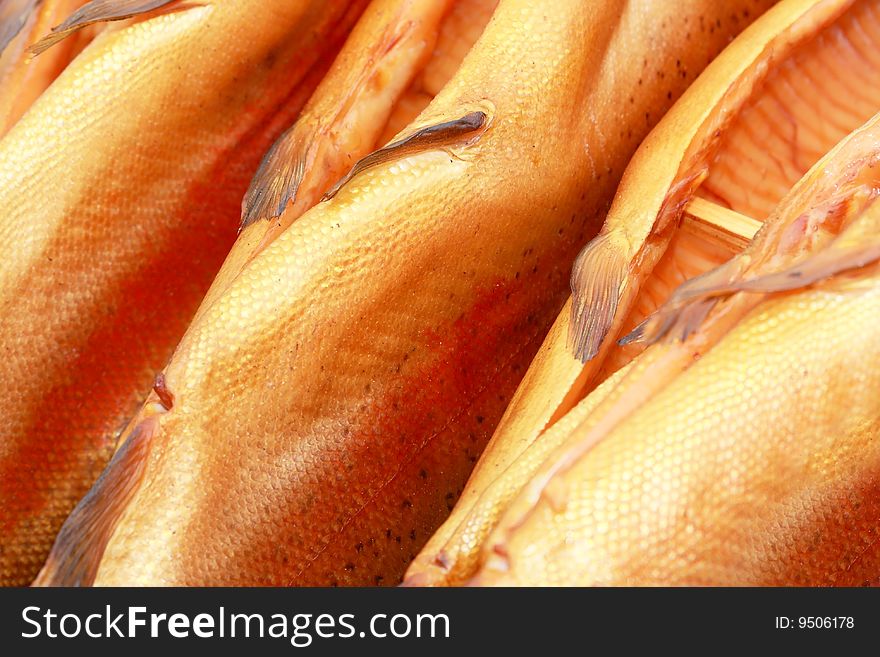 Few fresh smoked appetizing salmons. Few fresh smoked appetizing salmons