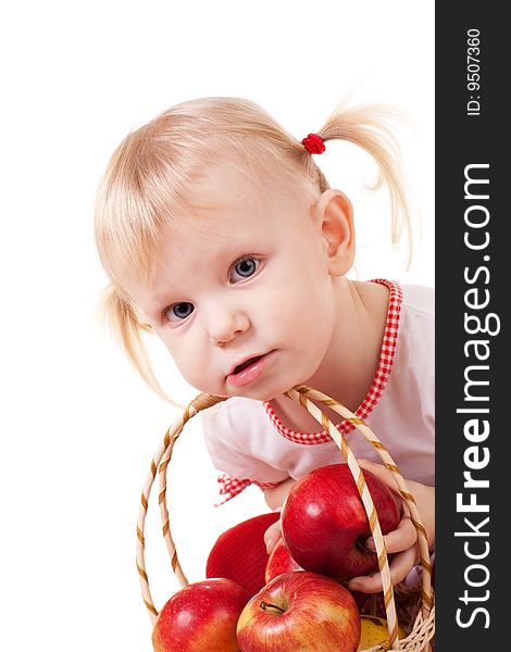 A small girl with apples. A small girl with apples
