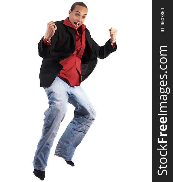 A young businessman with a red shirt - a jacket and blue jeans is jumping in joy. Isolated over white. Slight motion bluriness is intended. A young businessman with a red shirt - a jacket and blue jeans is jumping in joy. Isolated over white. Slight motion bluriness is intended.