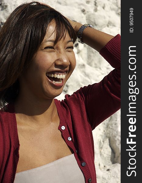 Pretty Asian woman enjoying herself on holiday. Pretty Asian woman enjoying herself on holiday.